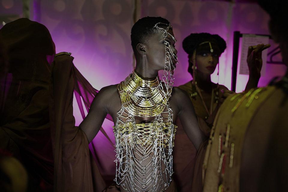 Models wait backstage before a show with the Paris-based Ivorian/French designer Mickael Kra, Abidjan, Ivory Coast. © Per-Anders Pettersson